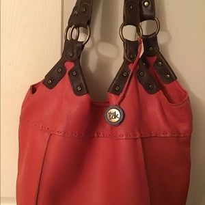 The Sak leather, bucket handbag. Peach color